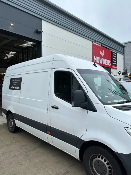 Professional delivery van parked outside Howdens for joinery and furniture collection service across the Midlands